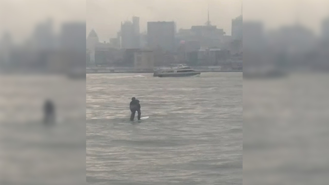 Paddleboarder commutes across the Hudson River to work (Watch)